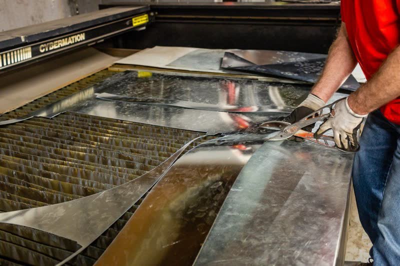 Plasma table cutting sheet metal in the Community II shop